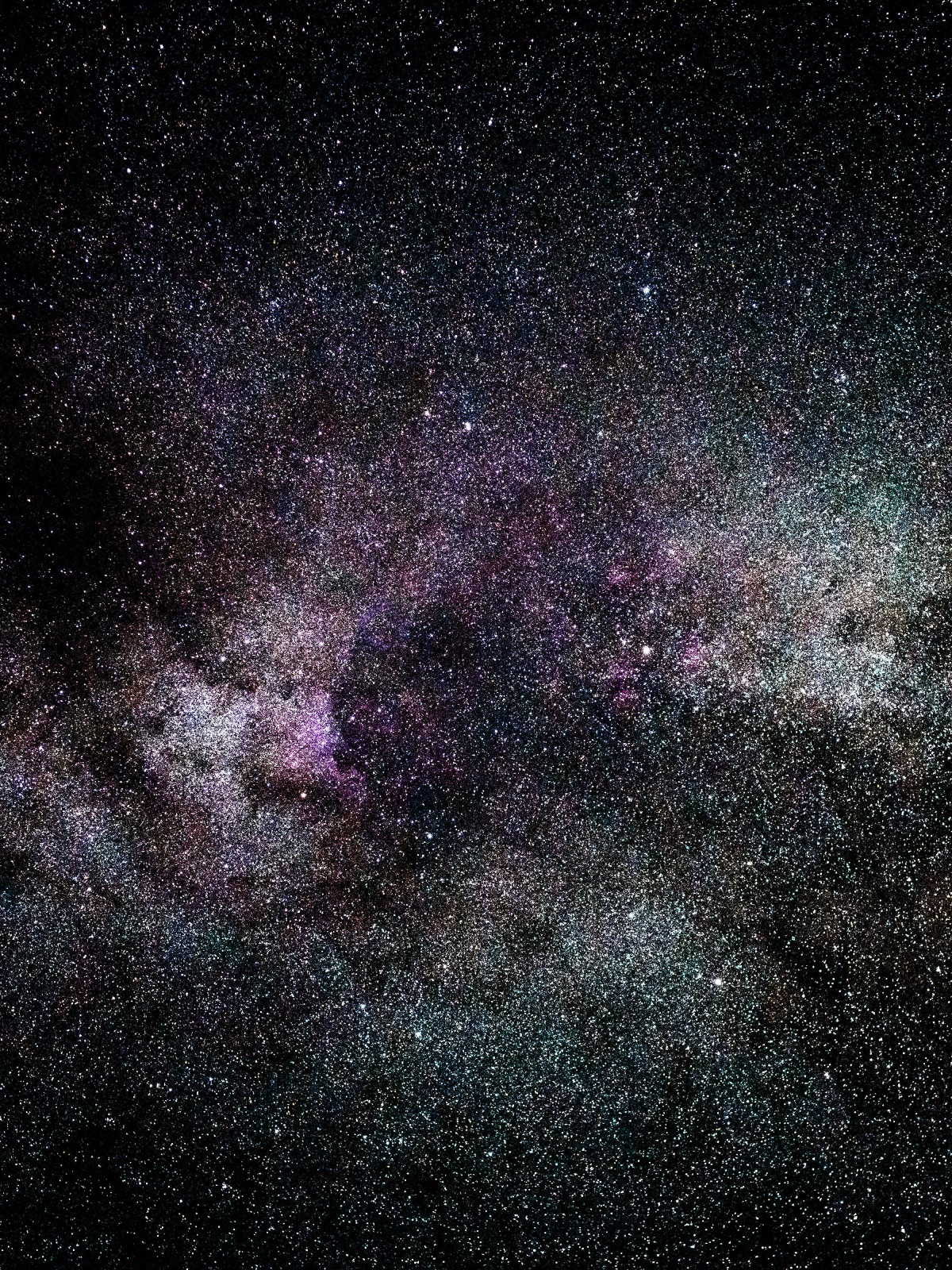 Horoskop Tygodniowy 21–27 Lipca 2025: Piękne różowo-zielone zdjęcie galaktyki z pełnym spektrum gwiazd i planet.