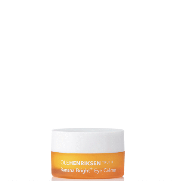 Ole Henriksen Banana Bright+ Eye Crème – słoiczek w intensywnie pomarańczowym kolorze z białą nakrętką, zawierający kultowy krem pod oczy z witaminą C i pigmentem „bananowym” rozświetlającym okolice oczu.