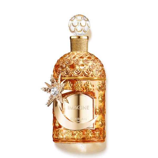 Luksusowy flakon perfum Guerlain Imagine w złotym, rzeźbionym opakowaniu z dekoracyjnym motywem gwiazdy i księżyca. Złote tłoczenia i szklana faktura butelki podkreślają wyjątkowy charakter kolekcji haute parfumerie.